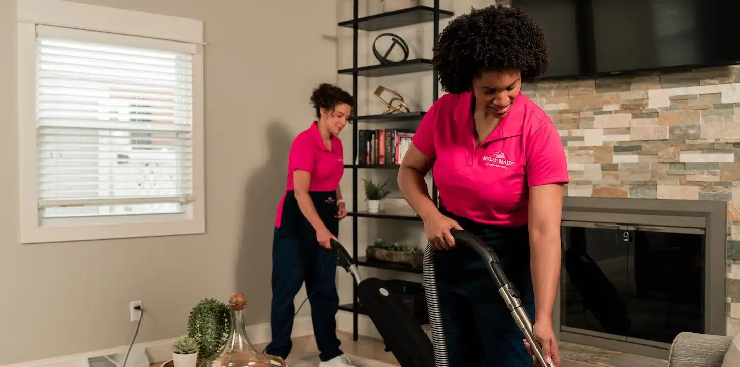 Maids cleaning a room.